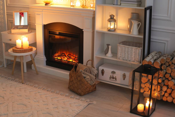 istock Beautiful fireplace and different decor in living room at night. Interior design 1500091230