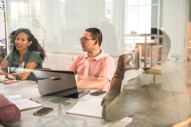 istock Diverse Team of Ambitious Professionals Engaged in Project Presentation 1500092598
