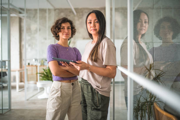istock Female Digital Marketers Standing In the Modern Office 1500092641