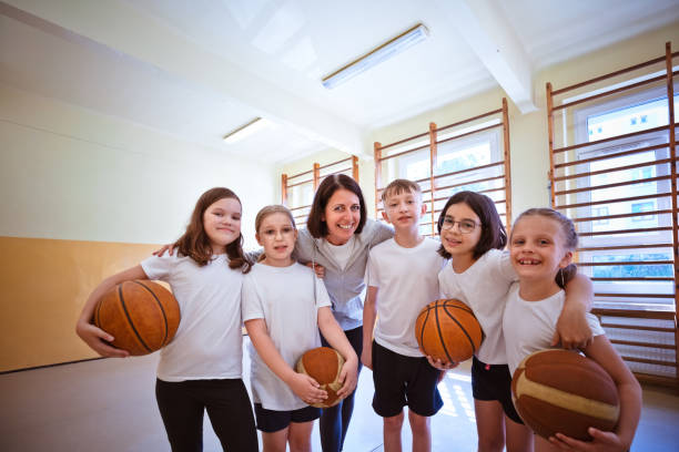 istock Teacher and elementary students during sport lesson 1500093180