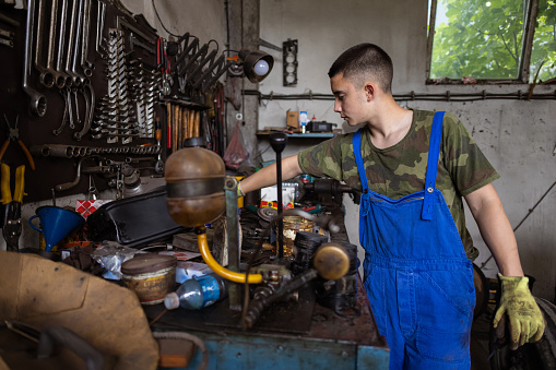 One young man learning the business at his grandfather's workshop