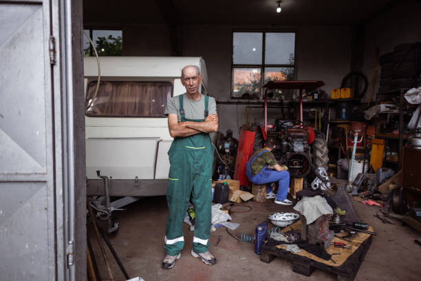 istock Car repairman in his garage 1500095183