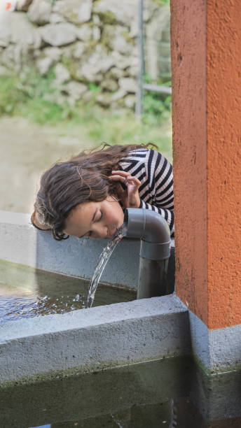 istock girl drinks water 1500095688