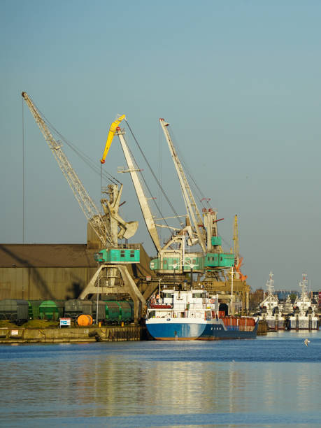 istock Harbor view with ships and cranes in sunset light, Liepaja, Latvia 1500097220