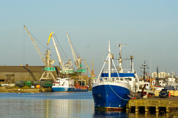 Harbor view with ships and cranes in sunset light, Liepaja, Latvia, Baltic sea