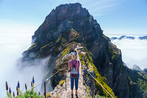 Hiker on PR1 Pico do Arieiro - Pico Ruivo trail Stairway to Heaven Madeira Portugal