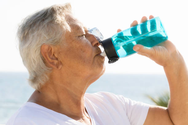 istock Senior woman drinking water 1500098124