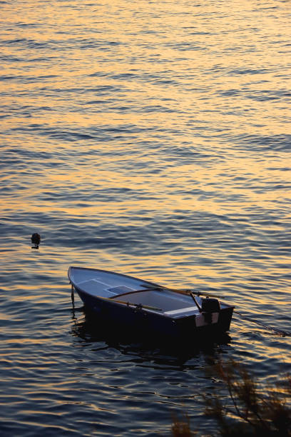 istock Sunset and Small Fishing Boat 1500100104