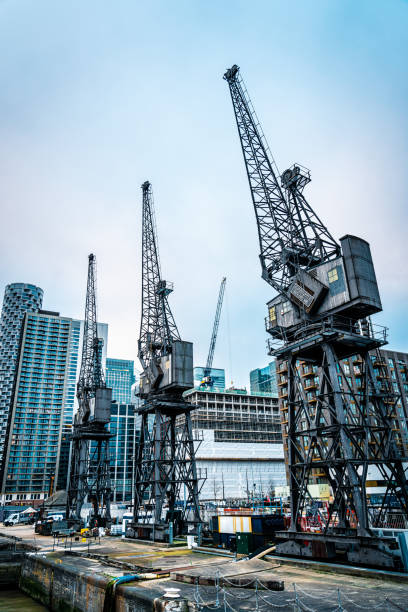 Three tall cranes at Canary Wharf in London