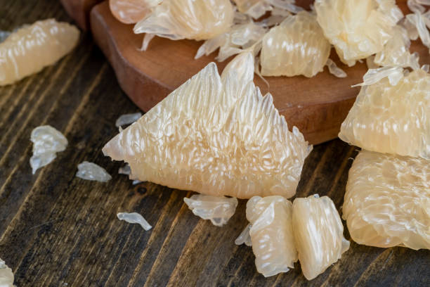 istock Freshly peeled pink pomelo on the table 1500109964