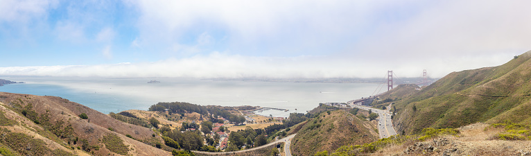 Large panorama of the San Fransisco coast with Route 101 leading towards the Golden Gate Bridge - California