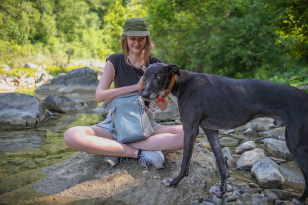 istock Hiking with my cute dog by the river 1500110858