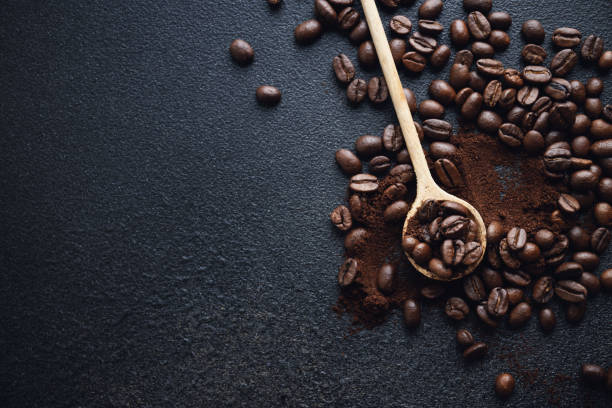 istock Coffee beans on wooden old background 1500113691