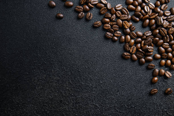 istock Coffee beans on wooden old background 1500113692