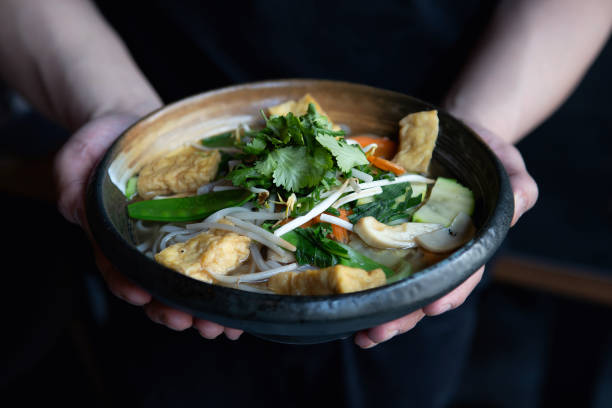 istock Man eating healthy asian noodles 1500114001