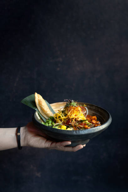 istock Man eating healthy asian soup 1500114119