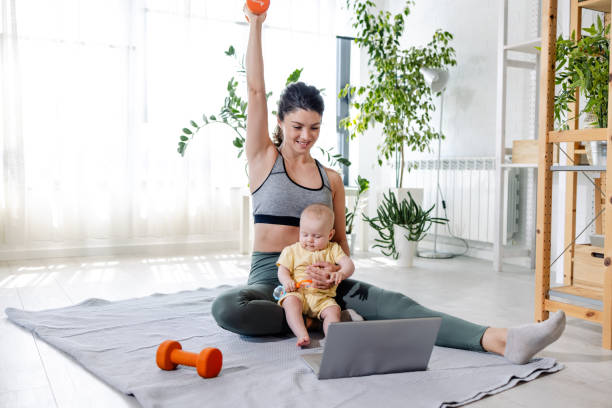 istock A young woman is practicing weight training with a video lesson on the laptop 1500114313