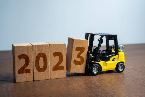 istock Forklift truck makes 2023 year from blocks. 1500117722