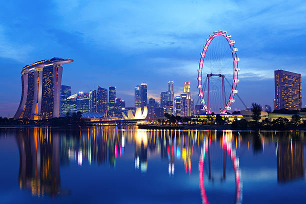 istock Illuminated Singapore cityscape over the waters at night 150012175