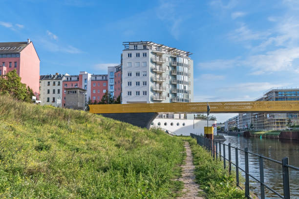 Berlin-Spandau shipping canal  with the new bridge Golda-Meir-Steg in Berlin, Germany Berlin, Germany - September 23, 2022: Nordhafen harbor with the new bridge Golda-Meir-Steg over the Berlin-Spandau shipping canal and the watchtower of the Guenter Litfin Memorial at Kieler Eck moabit stock pictures, royalty-free photos & images