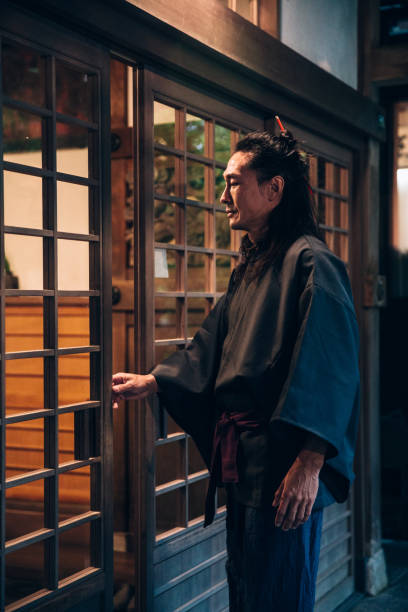 istock Japanese man entering his home 1500129437