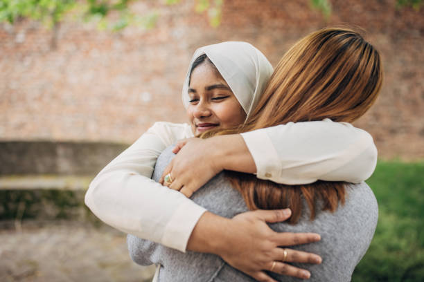istock Women friends hugging 1500130922