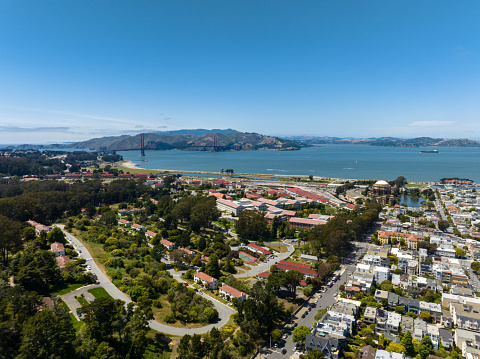 Aerial shot of the Golden Gate Bridge as seen from over Lombard Street in San Francisco on a sunny day. This still image is part of a series; a time lapse video is also available.