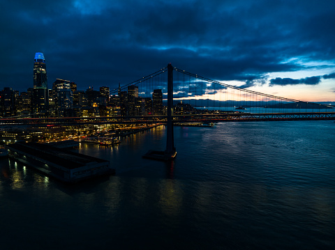 istock San Francisco Financial District and Bay Bridge at Nightfall - Aerial 1500131800