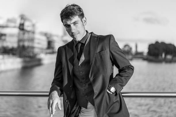 istock an attractive man in suit over near the river. 1500131835