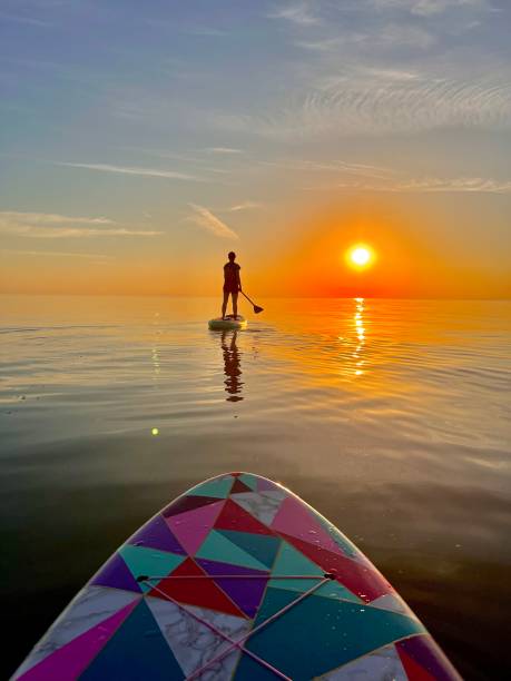 istock Sunrise Paddleboarding into the horizon 1500133855