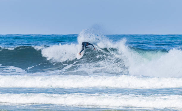 istock Young athletic surfer rides the wave 1500139312