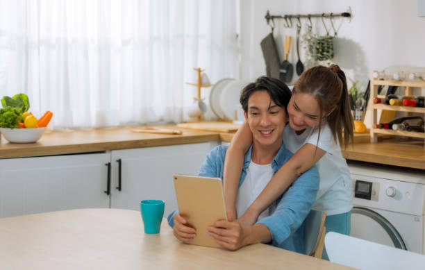 istock Married couples spend a few tender minutes before staring their workday. Sharing, laughing, teasing, serving each other loaf and beverage, Mutual understanding, sympathy and a supportive life partner 1500139707