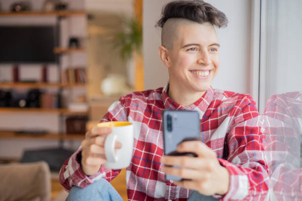 istock Happy young woman using phone 1500141546