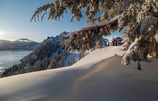 Lake Weissensee in Austrian Alps in winter with scenic reflection