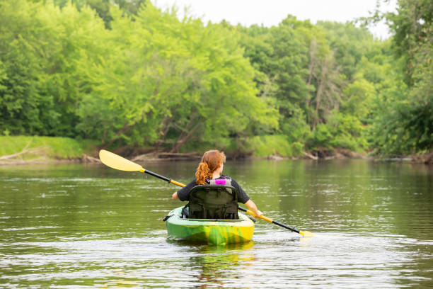 istock Girl Kayaking Down Rum River in Summer 1500150237
