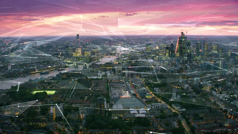 Aerial view of London Skyline with connections. Technology-Futuristic. High tech view of the financial district connected through a network. Internet of Things. Artificial intelligence. RED 8K.