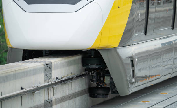 istock Elevated monorail train on rail. Guide wheels rubber tire on concrete guideway beam with conductor rail. Monorail technology. Modern mass transit. Rail transportation. Driverless straddle monorail. 1500172104