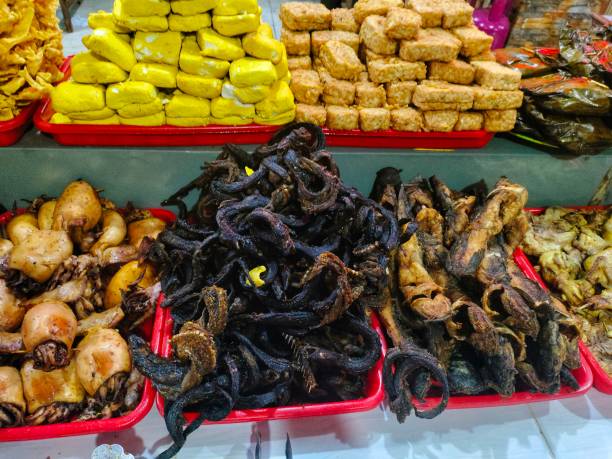 istock Indonesian food is available. Fried tempeh, fried tofu, fried eel, fried squid and catfish 1500172331