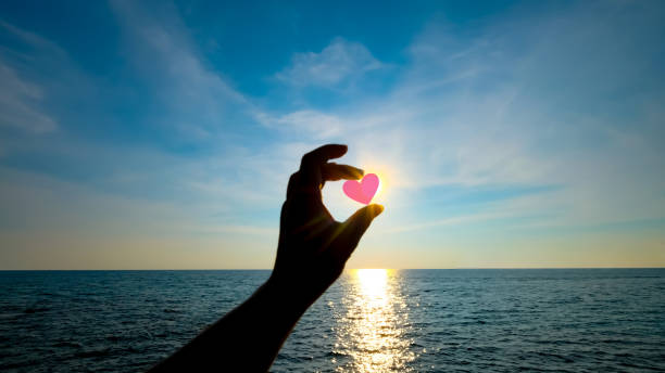 istock A woman hand hold red heart shape 1500172437