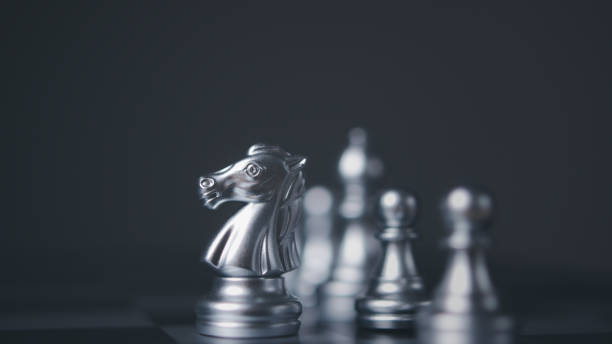 istock Silver horse chess encounters. Chess board game, business competitive. 1500175969