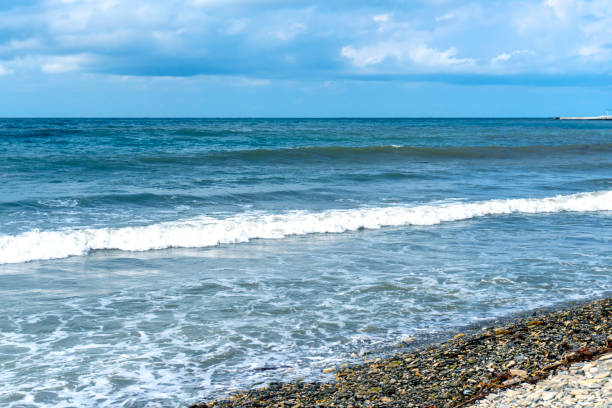 istock small storm on the sea, waves hitting the shore 1500176767