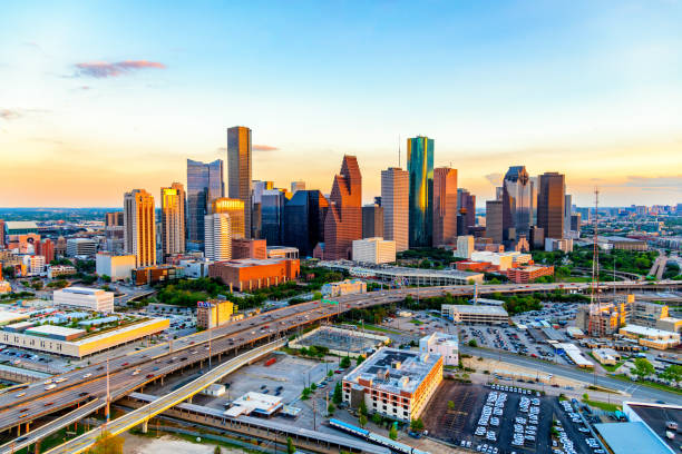 downtown houston at sunset - houston-texas bildbanksfoton och bilder