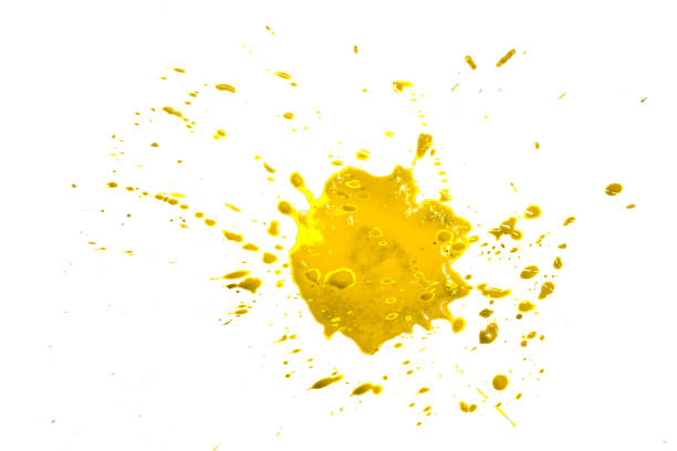istock closeup drops of golden isolated on white background,abstract pattern 1500182390