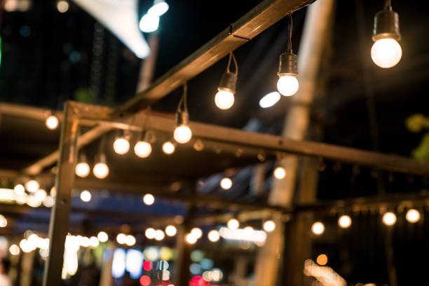 istock Hanging lamp with line bokeh lights background 1500183963
