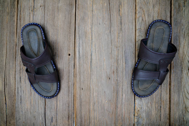 close-up of worn slippers on the floor