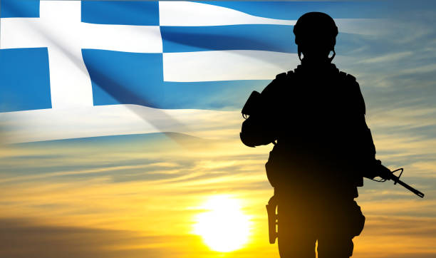istock Silhouette of a soldier with Greece flag against the sunset sky 1500188271