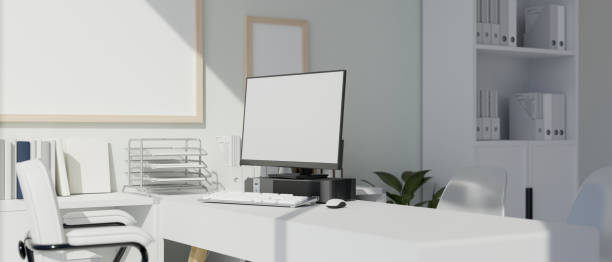 istock A modern white office with computer mockup on a table. doctor office, teacher room, front desk. 1500189765