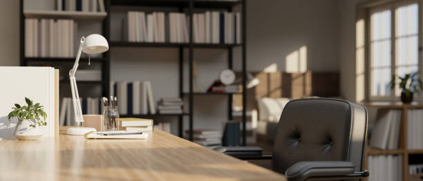 istock An empty space mockup on a wooden tabletop in a modern contemporary office room. 1500189771