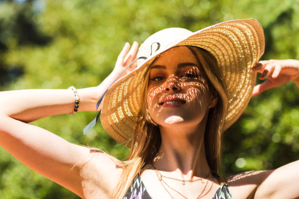 istock Young woman protecting herself from sun on summer day 1500189781