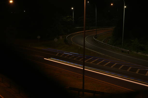 istock Colorful light trails, long time exposure motion blur effect in street 1500198792